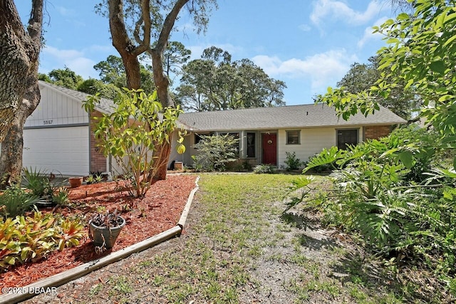 5967 Plantera Ct, Port Orange, FL 32127 - single story home with a garage and brick siding