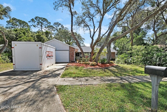 5967 Plantera Ct, Port Orange, FL 32127 - view of front of house with a garage, concrete driveway, brick siding, and a front lawn