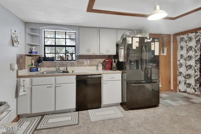 5967 Plantera Ct, Port Orange, FL 32127 - kitchen with black appliances, a sink, light countertops, and white cabinets