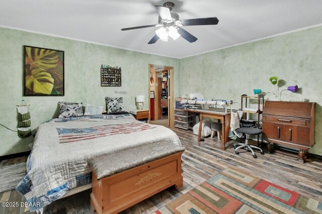 5967 Plantera Ct, Port Orange, FL 32127 - bedroom featuring wood finished floors, a ceiling fan, ornamental molding, and a walk in closet