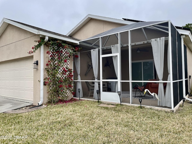 exterior space featuring a garage and a yard