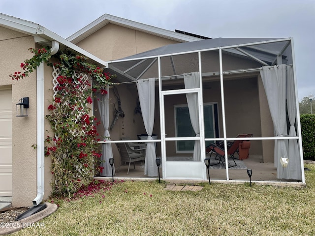 back of property featuring a yard and a patio