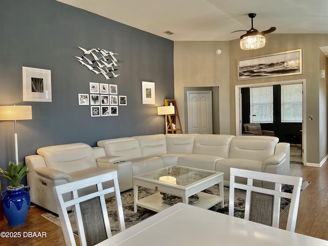 living room featuring hardwood / wood-style flooring and lofted ceiling