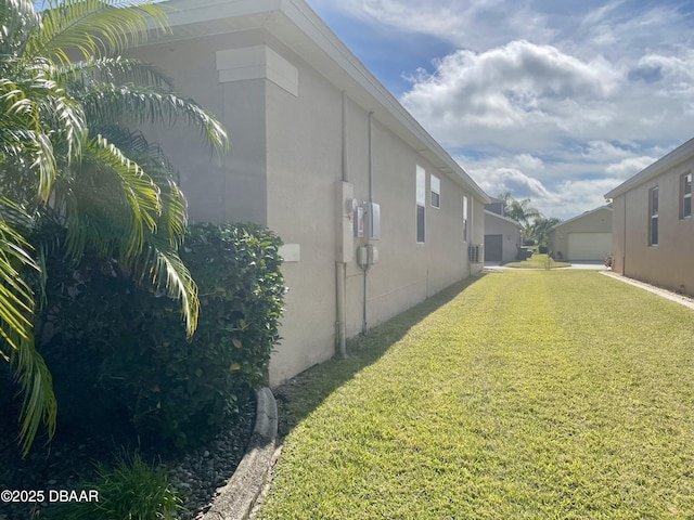 view of side of home featuring a yard