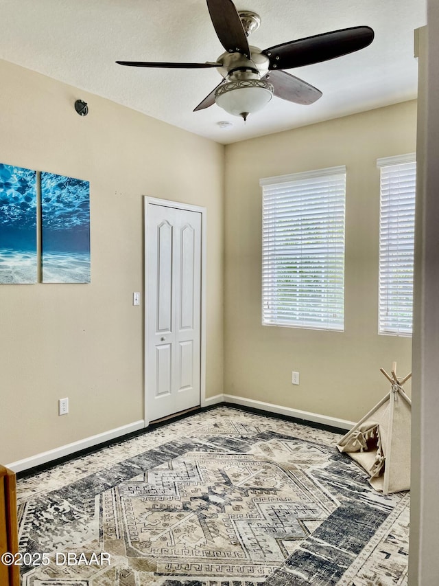 bedroom featuring a closet and ceiling fan