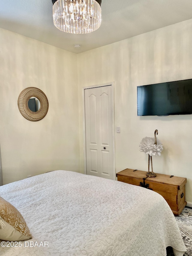 bedroom featuring a notable chandelier