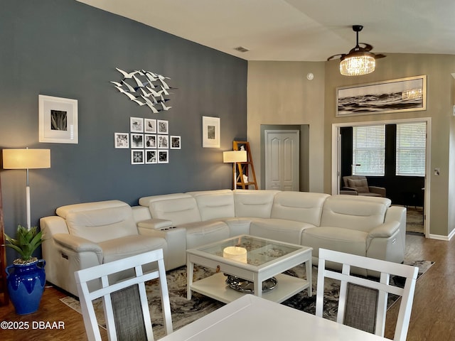 living room featuring hardwood / wood-style floors and vaulted ceiling