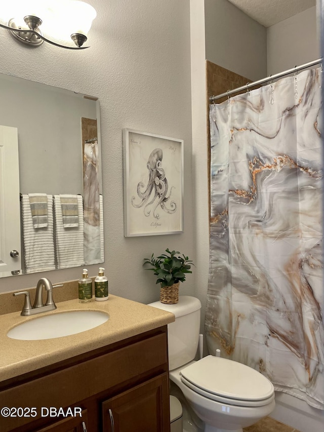 bathroom featuring vanity, a shower with curtain, and toilet