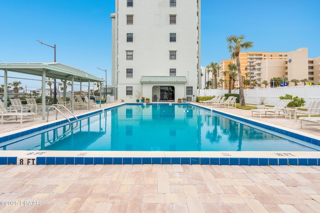 view of swimming pool featuring a patio area