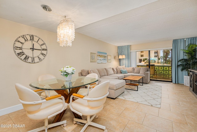 dining room featuring light tile patterned floors and a notable chandelier