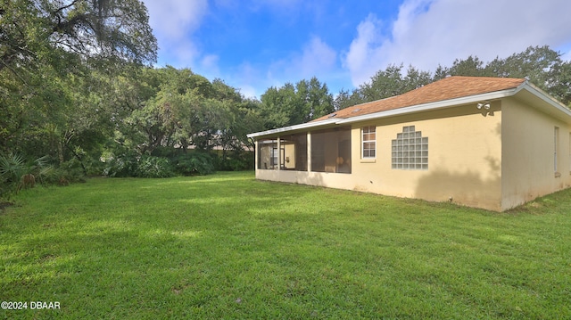 view of yard with a sunroom