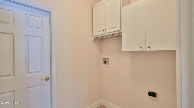 laundry room featuring washer hookup and cabinets