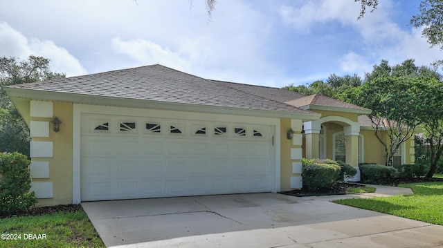 view of front of home with a garage