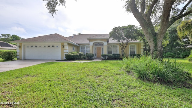 single story home with a garage and a front lawn