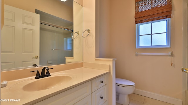 bathroom with vanity, walk in shower, tile patterned floors, and toilet