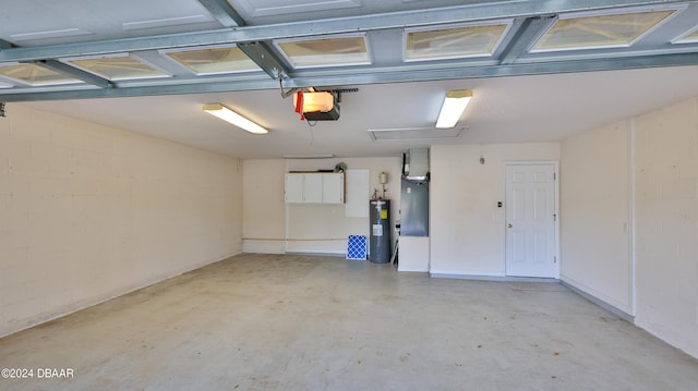 garage featuring electric water heater and a garage door opener