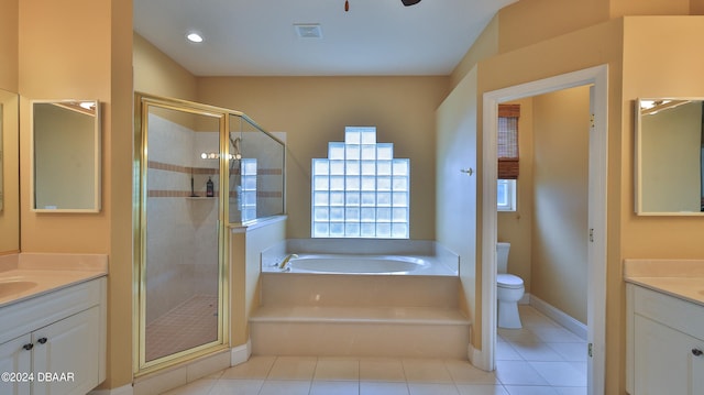 full bathroom featuring vanity, tile patterned floors, toilet, and shower with separate bathtub