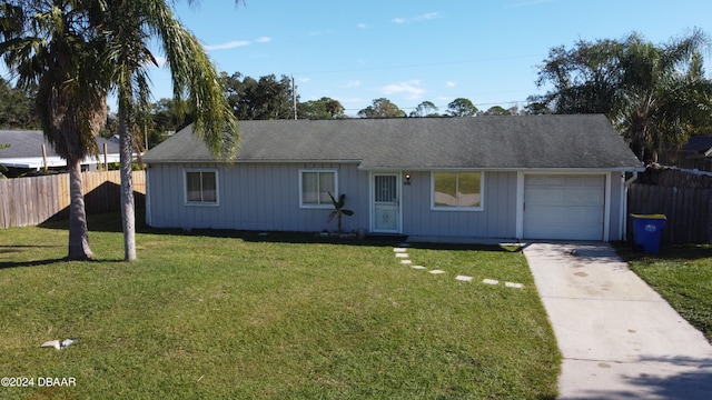 ranch-style house with a front lawn and a garage