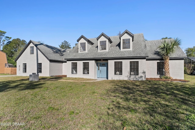 new england style home featuring a front yard