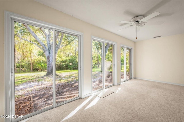 interior space with ceiling fan