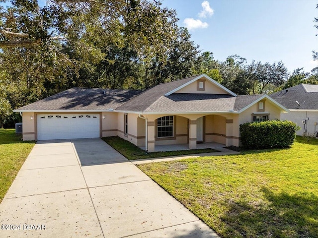 single story home with central AC unit, a garage, and a front lawn