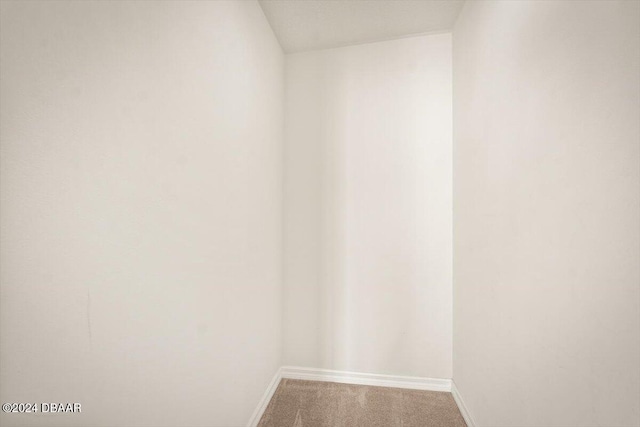 unfurnished room with carpet floors