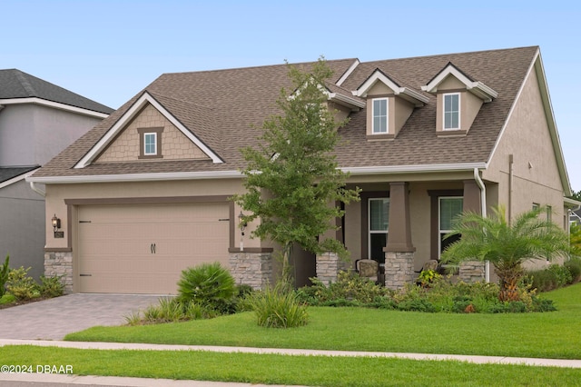 view of front of house featuring a garage and a front yard