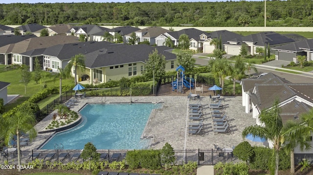 pool featuring a residential view and fence