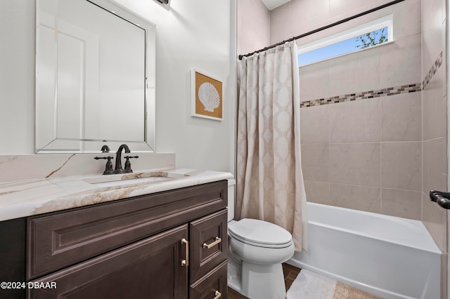 full bathroom with shower / bath combo, vanity, and toilet