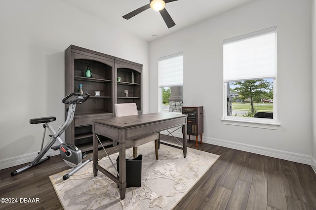 office with dark wood finished floors, ceiling fan, and baseboards