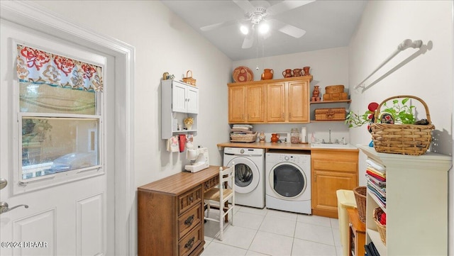 5711 John Anderson Hwy, Flagler Beach, FL 32136 - laundry area with washing machine and clothes dryer, cabinet space, light tile patterned floors, and ceiling fan