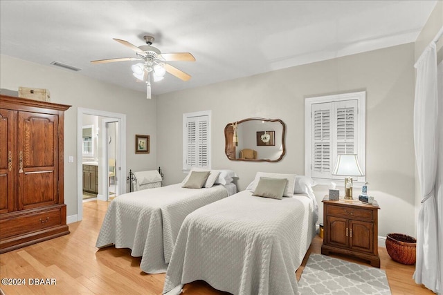 5711 John Anderson Hwy, Flagler Beach, FL 32136 - bedroom featuring light wood finished floors, a ceiling fan, and baseboards