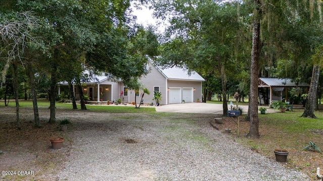 5711 John Anderson Hwy, Flagler Beach, FL 32136 - view of front of home with concrete driveway and an attached garage