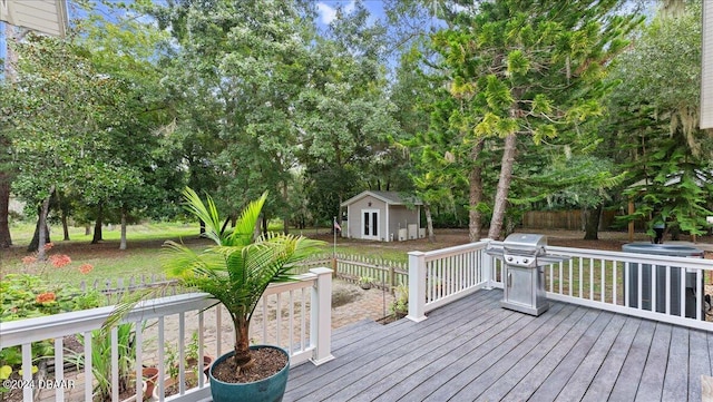 deck with an outbuilding and area for grilling