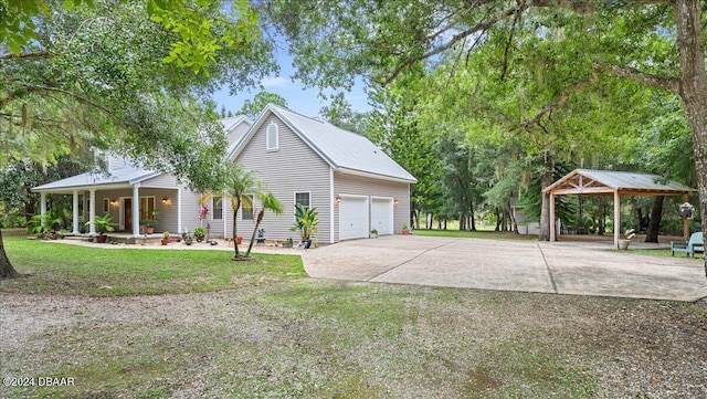 view of home's exterior with a lawn and a garage