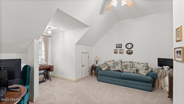 5711 John Anderson Hwy, Flagler Beach, FL 32136 - carpeted living area with ceiling fan, vaulted ceiling, and baseboards