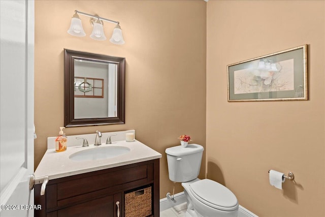 bathroom with toilet and vanity