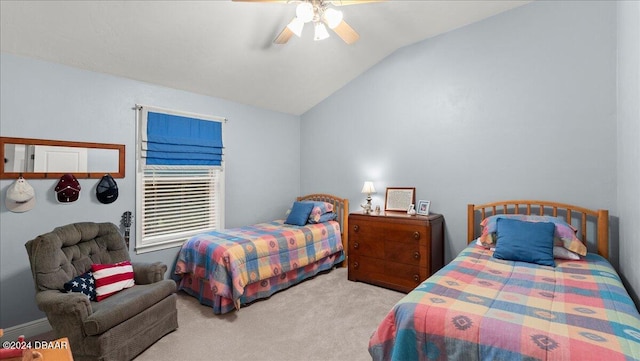 carpeted bedroom featuring ceiling fan and vaulted ceiling