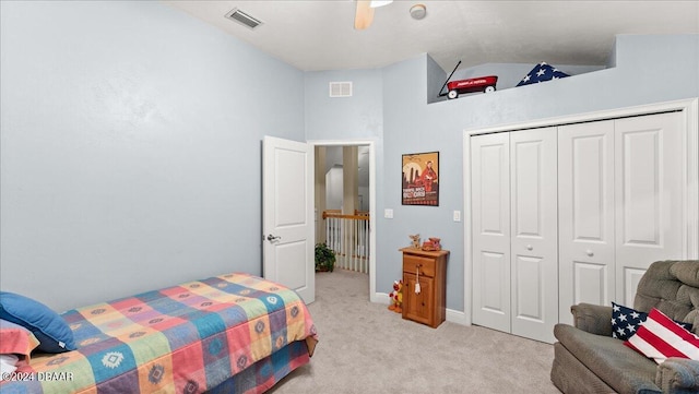 5711 John Anderson Hwy, Flagler Beach, FL 32136 - bedroom featuring light carpet, a closet, a ceiling fan, and high vaulted ceiling