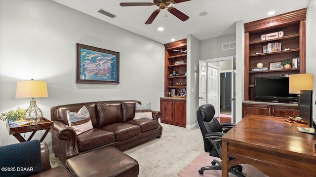 office space featuring ceiling fan and light colored carpet