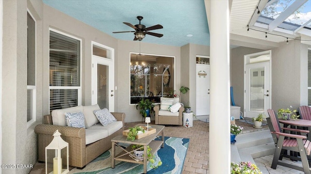 view of patio / terrace featuring outdoor lounge area, ceiling fan, and a pergola