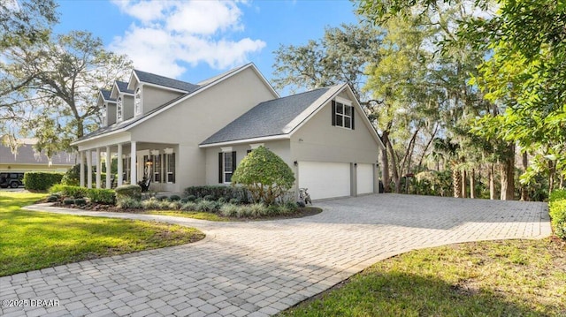 view of side of home featuring a garage and a yard