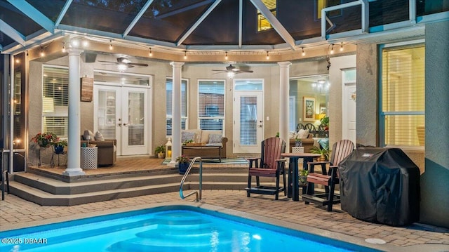 view of swimming pool featuring french doors, a patio area, area for grilling, a lanai, and ceiling fan