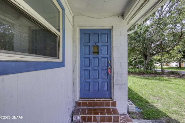 607 Marlene Dr, Holly Hill, FL 32117 - entrance to property with a yard and concrete block siding