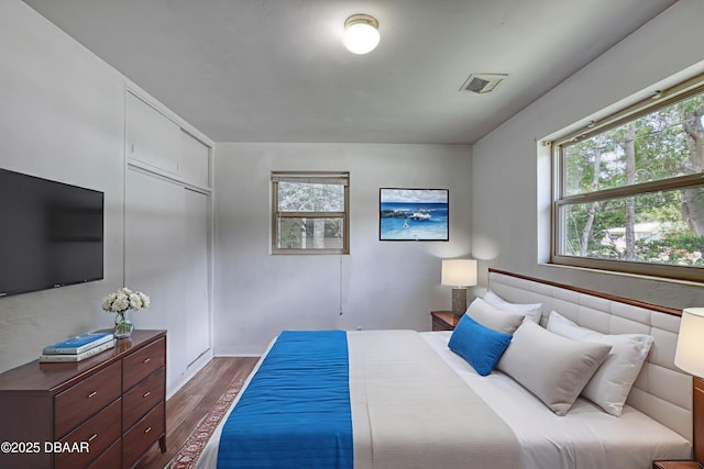 607 Marlene Dr, Holly Hill, FL 32117 - bedroom featuring wood finished floors and a closet