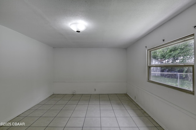 607 Marlene Dr, Holly Hill, FL 32117 - spare room with a textured ceiling and light tile patterned floors