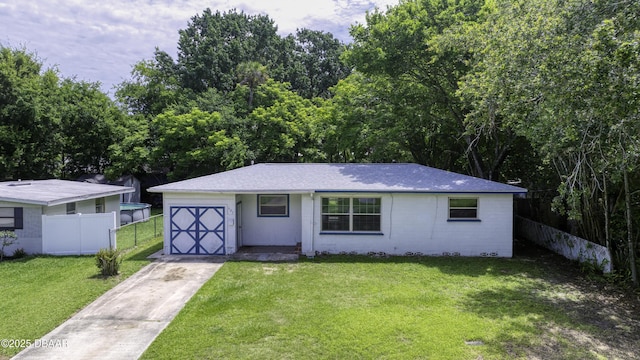 607 Marlene Dr, Holly Hill, FL 32117 - view of front facade featuring a shingled roof and driveway