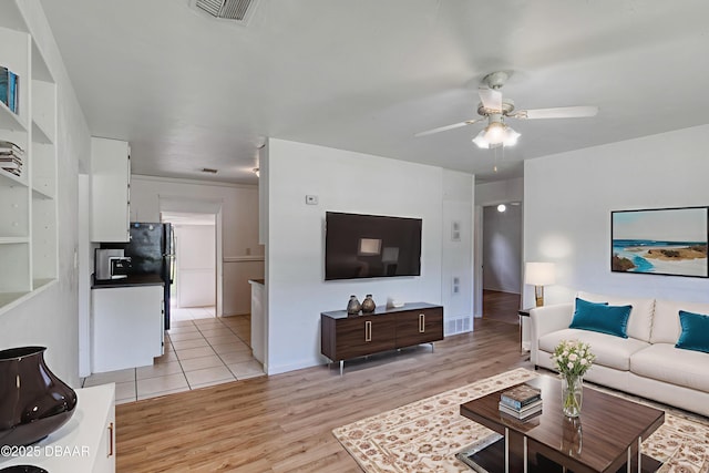 607 Marlene Dr, Holly Hill, FL 32117 - living room featuring a ceiling fan and light wood-style floors
