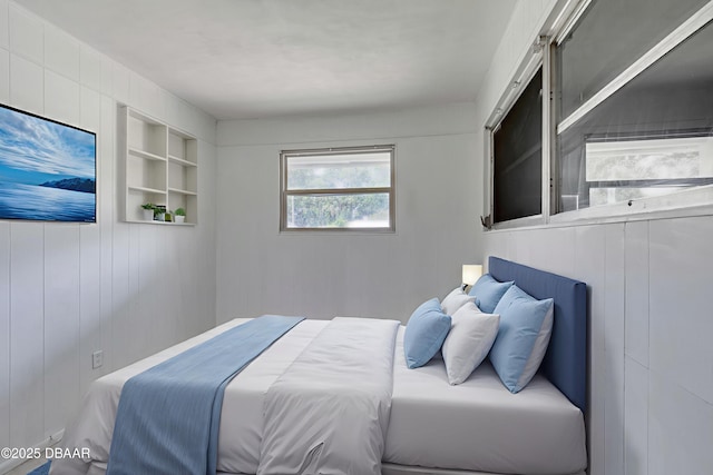 607 Marlene Dr, Holly Hill, FL 32117 - bedroom featuring wood walls