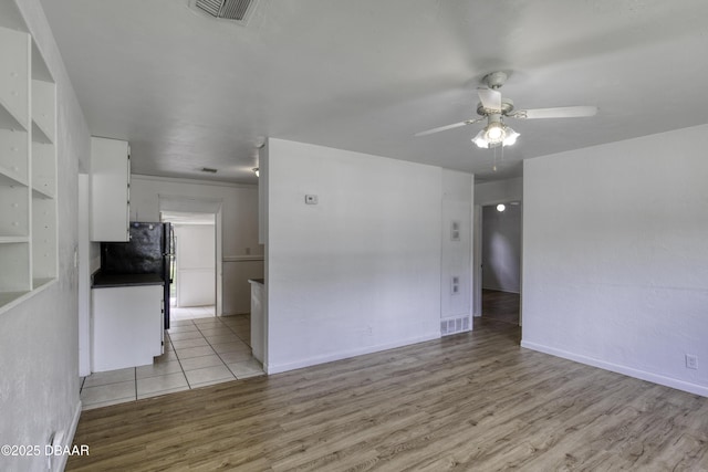 607 Marlene Dr, Holly Hill, FL 32117 - unfurnished living room with a ceiling fan and light wood-style floors